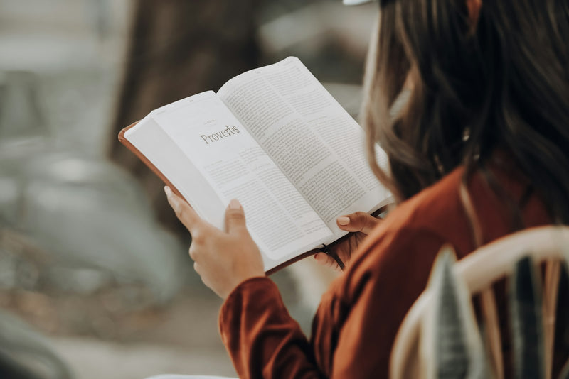 A young girl reading a book, growing in confidence