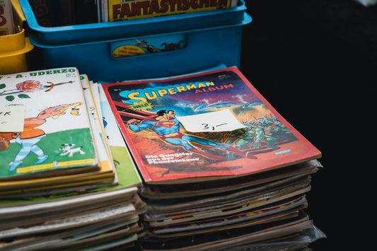 A stack of colorful children's books piled on top of a table