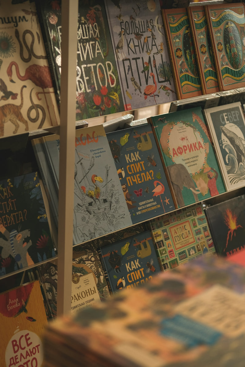 A bookshelf densely packed with colorful children's books.